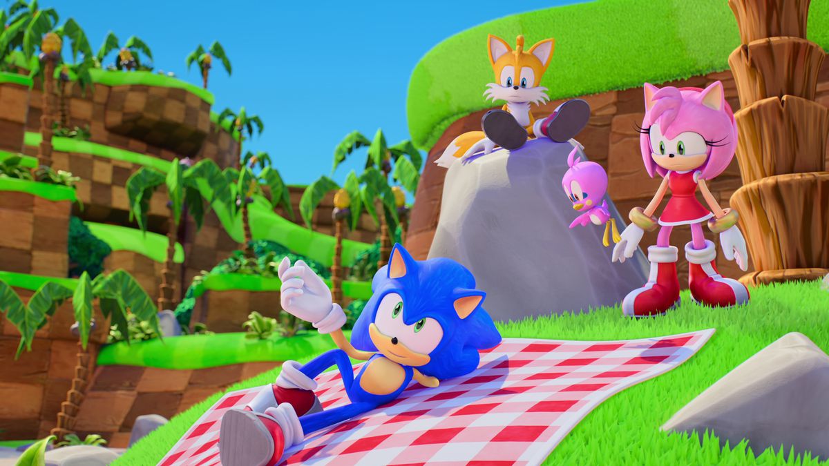 Sonic si rilassa su un cestino da picnic nella zona collinare verde con Tails e Amy in Sonic Prime