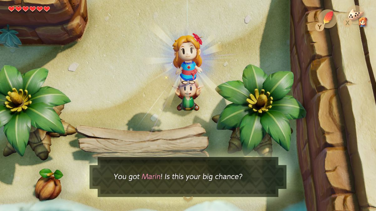 Link solleva Marin sopra la sua testa come se fosse un nuovo oggetto nel remake di The Legend of Zelda: Link's Awakening