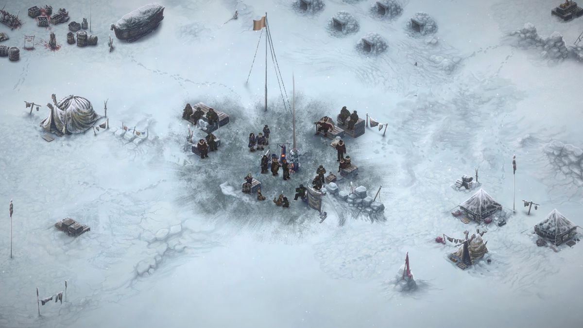 L'equipaggio di The Pale Beyond si stringe intorno a una buca per la pesca nel ghiaccio al centro del suo accampamento