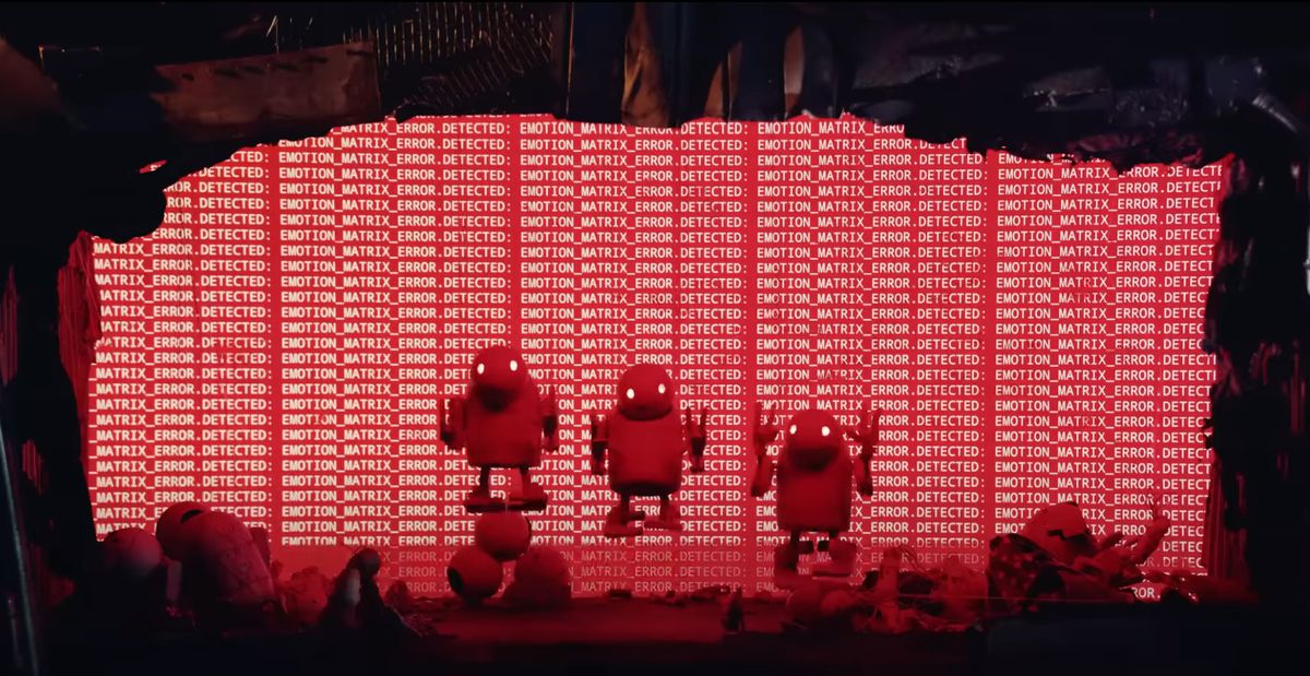 tre pupazzi robot che saltano all'unisono mentre sono circondati da corpi di robot morti e una schermata rossa con un messaggio di errore sullo sfondo.