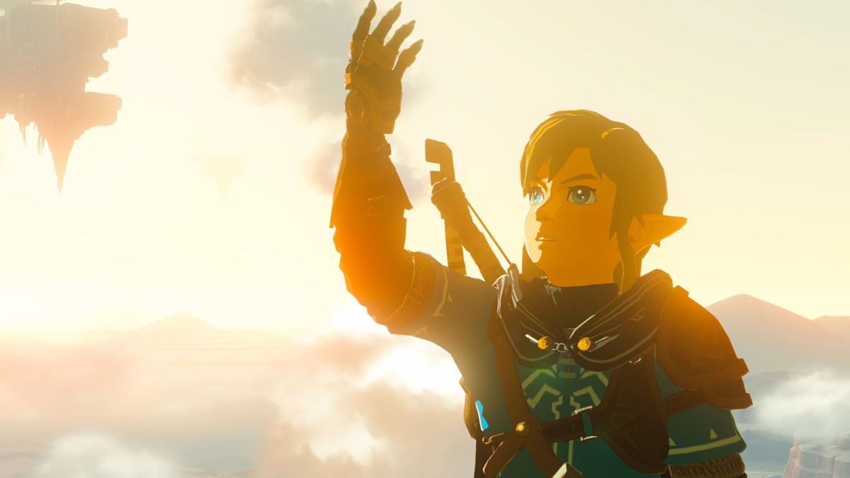 Link da The Legend of Zelda: Tears of the Kingdom che esamina il suo strano guanto meccanico