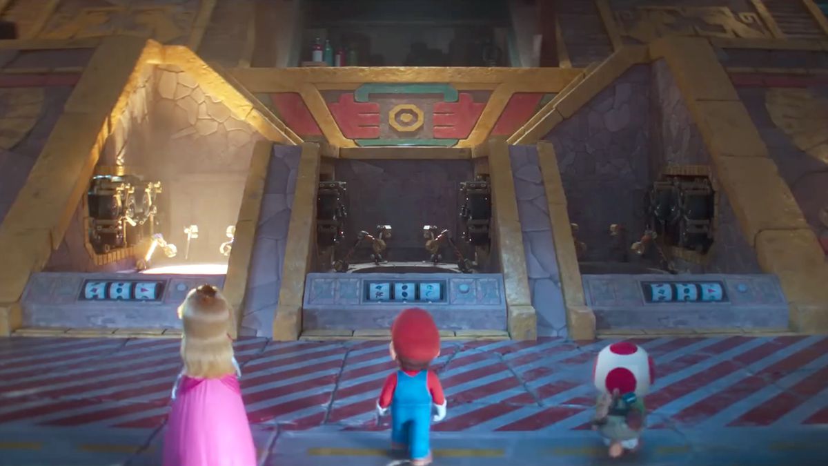 Peach, Mario e Toad si avvicinano a un garage in The Super Mario Bros Movie, dove stanno per scegliere i loro kart per una gara