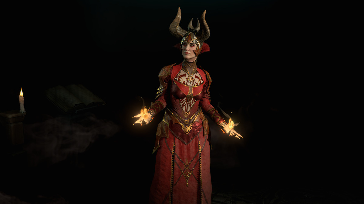 Stregone in piedi nell'oscurità con il fuoco che le illumina le mani in Diablo 4