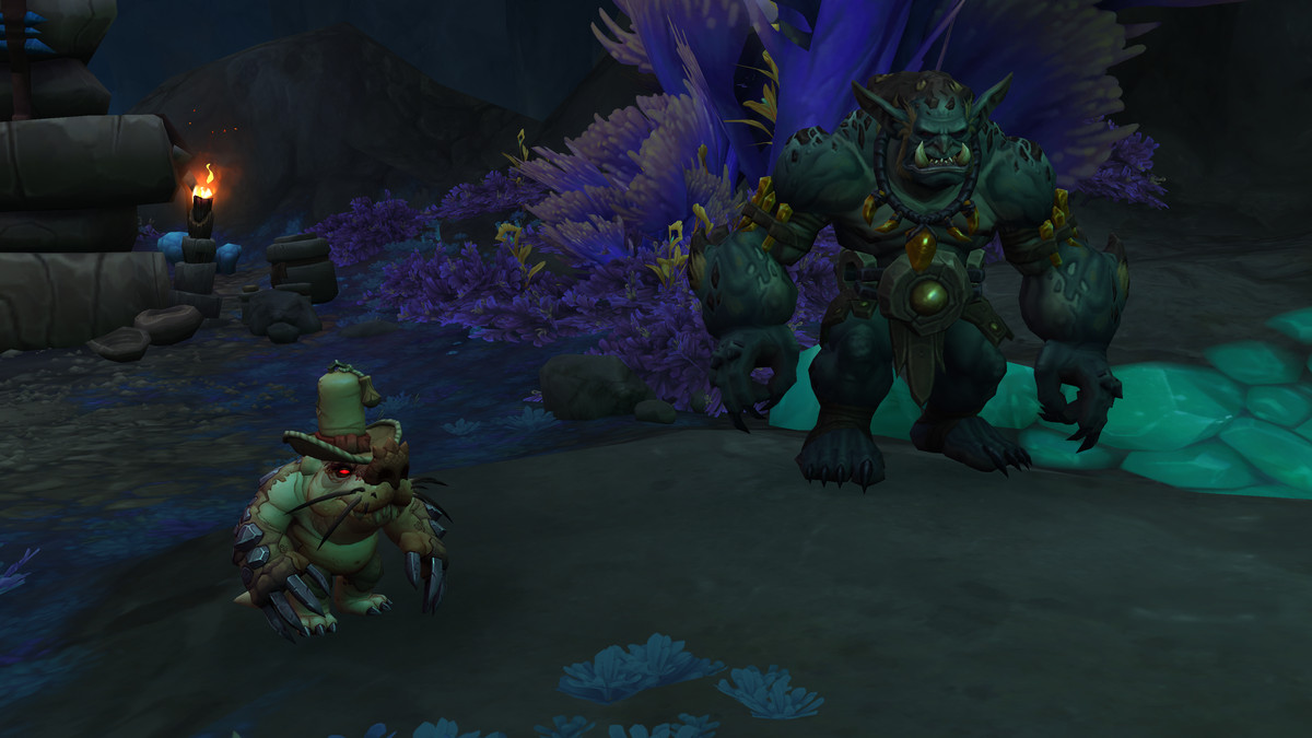 World of Warcraft - Un drogbar e un niffen si aggirano nella Caverna di Zaralek.  Il drogbar è un tipo grande e massiccio con muscoli e grandi denti, mentre il Niffen è una piccola talpa rotonda con un cappello carino.