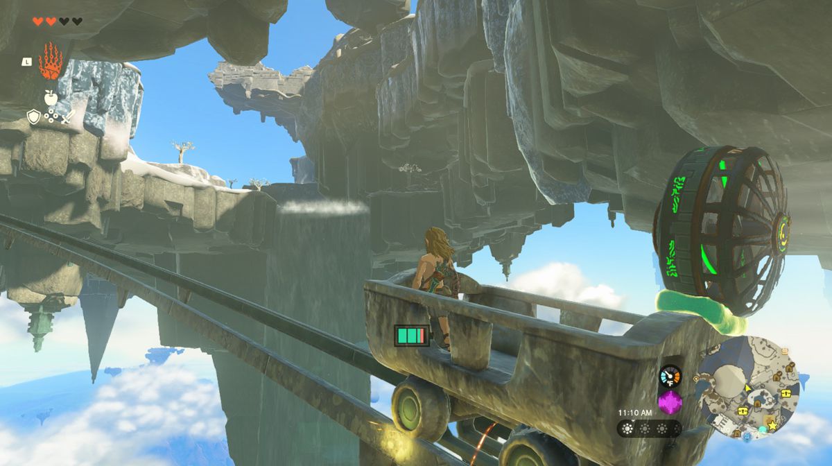 Link guida un carrello minerario con un fan sulla Great Sky Island in Zelda Tears of the Kingdom.