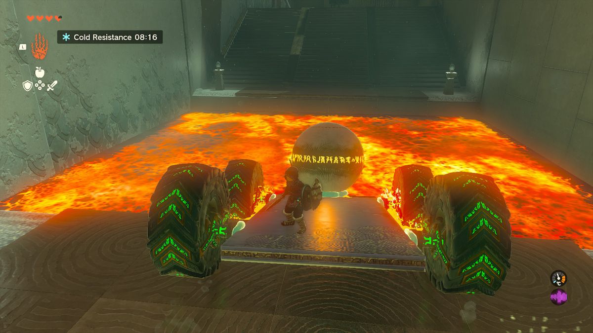 Link cavalca un carro con sopra una sfera attraverso una pozza di lava nel Santuario Tukarok in Zelda Tears of the Kingdom.