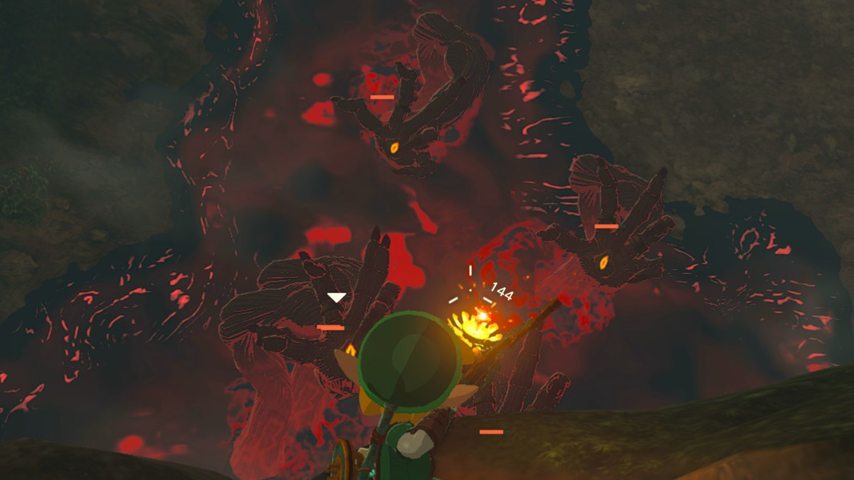 Link che scaglia una freccia bomba da un terreno più alto nel mezzo di cinque mani tenebrose in The Legend of Zelda: Tears of the Kingdom