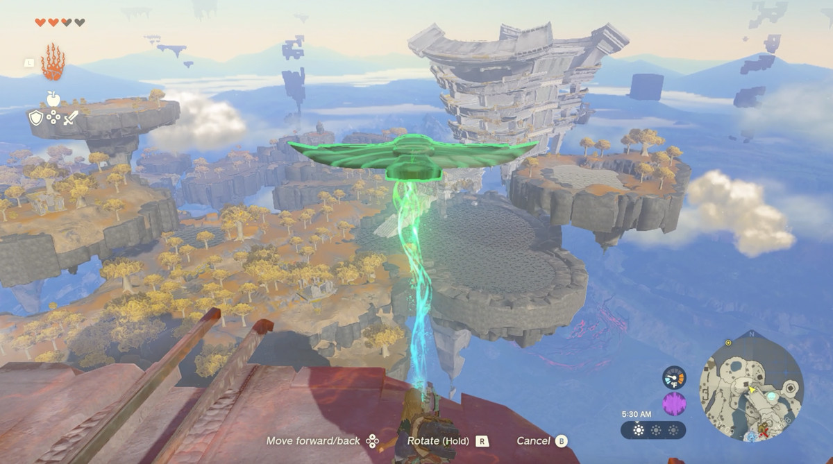 Link usa Ultrahand per sospendere un'ala da una scogliera vicino al Tempio del Tempo sulla Great Sky Island in Zelda Tears of the Kingdom.