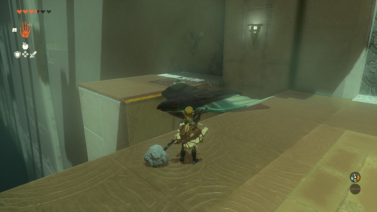 Link posiziona un'ala tra due sporgenze per creare un ponte nel Santuario Jirutagumac in Zelda Tears of the Kingdom.