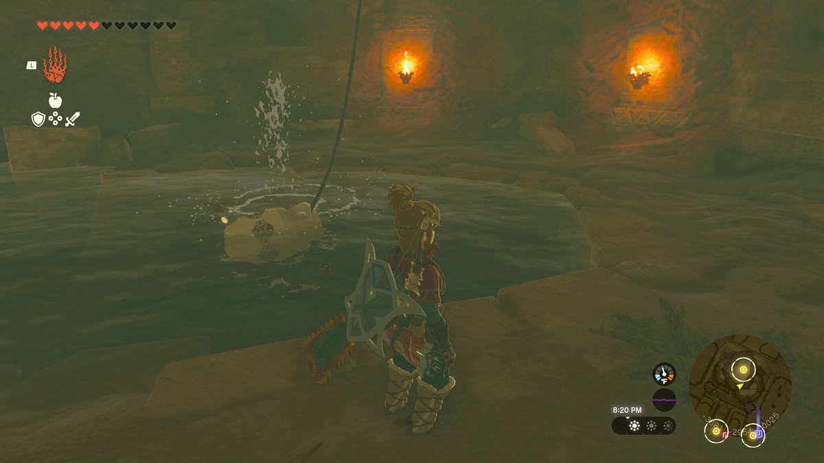 Link si trova accanto alla fonte d'acqua di un pozzo in Tears of the Kingdom.  Il pozzo è illuminato e ha un vaso e una corda per raccogliere l'acqua che pende dall'alto