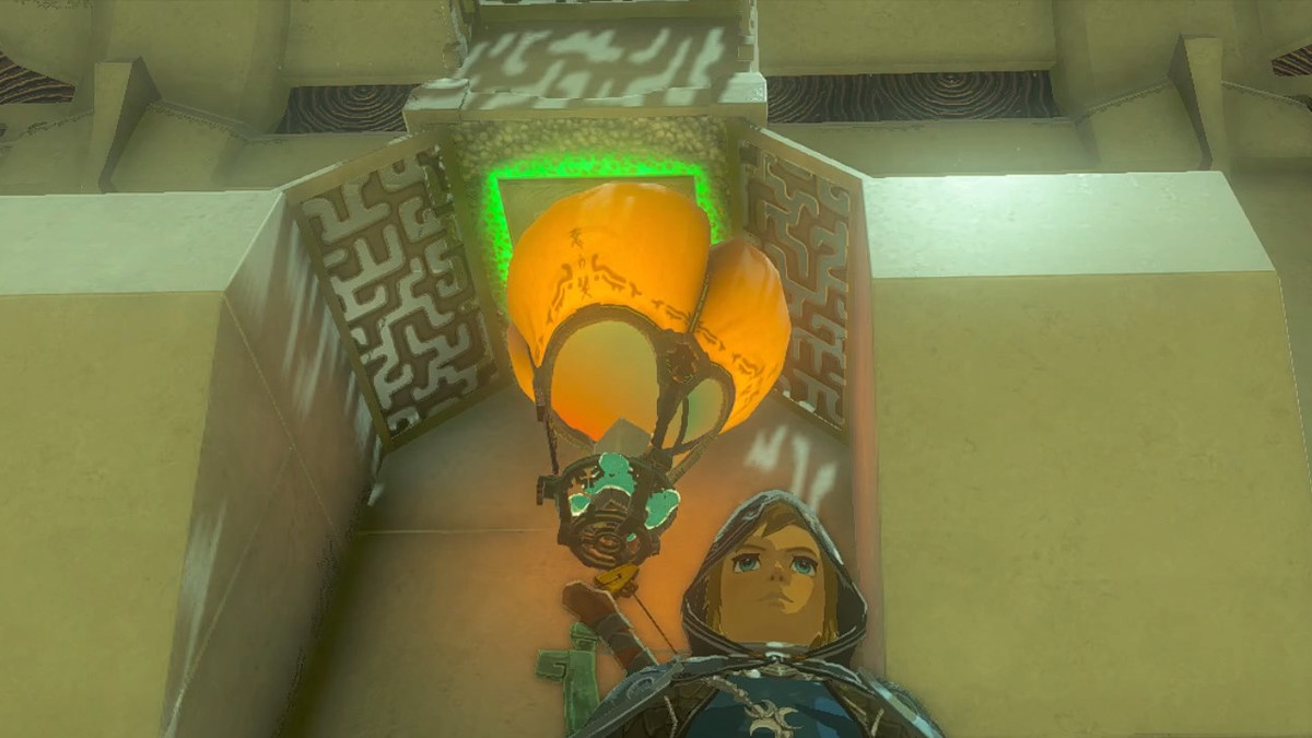 Link in piedi accanto a una mongolfiera che attiva un interruttore nel Santuario Sinakawak in The Legend of Zelda Tears of the Kingdom
