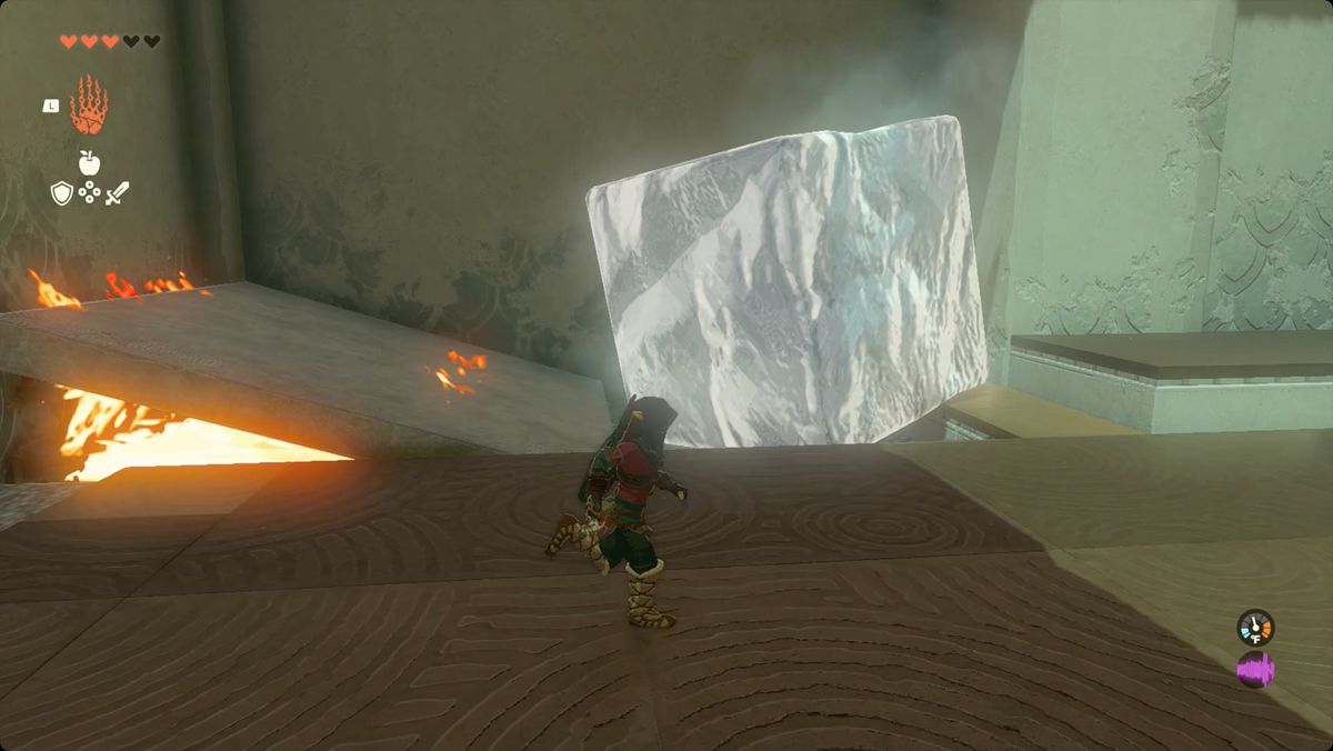 The Legend of Zelda: Tears of the Kingdom Link usa un pannello di pietra per bloccare le fiamme nel Santuario Kiuyoyou.