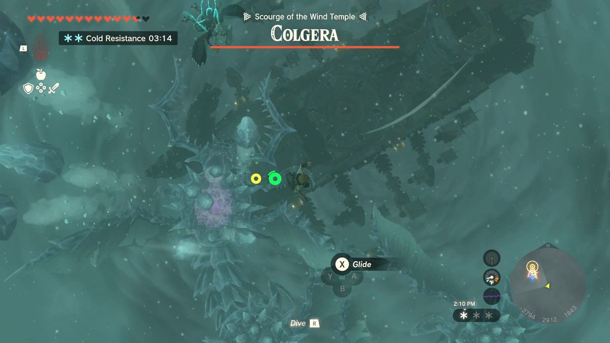 Link fluttua sopra il mostro gigante Colgera sul suo aliante in Zelda: Tears of the Kingdom.  La sua schiena è ricoperta da creste di punte fatte di ghiaccio.  Il suo nome si trova sopra una barra della salute completamente piena nella parte superiore dello schermo.
