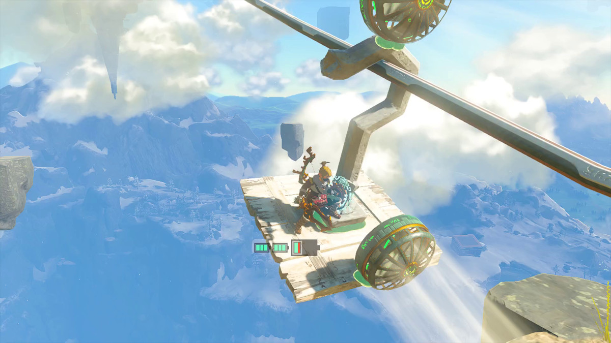 Link si trova su una gondola fatta di legno di scarto, un enorme gancio e due ventagli in Tears of the Kingdom