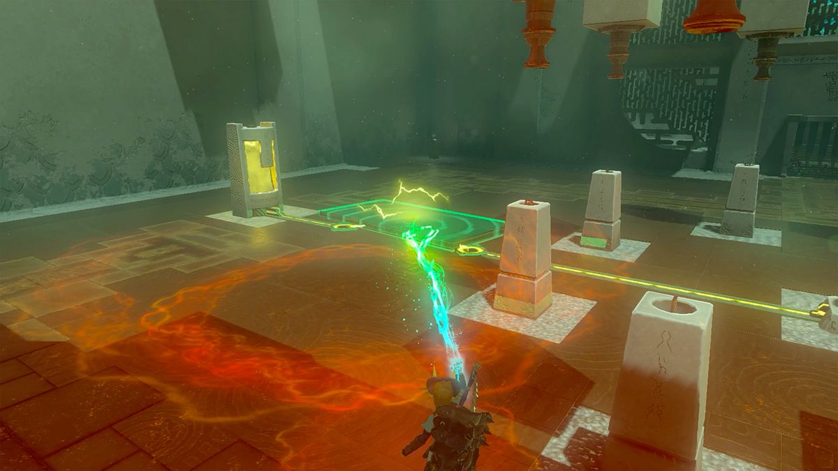 Link afferra una piastra di metallo usando Ultrahand nella parte 1 del puzzle Turbine Power nel Santuario Gemimik