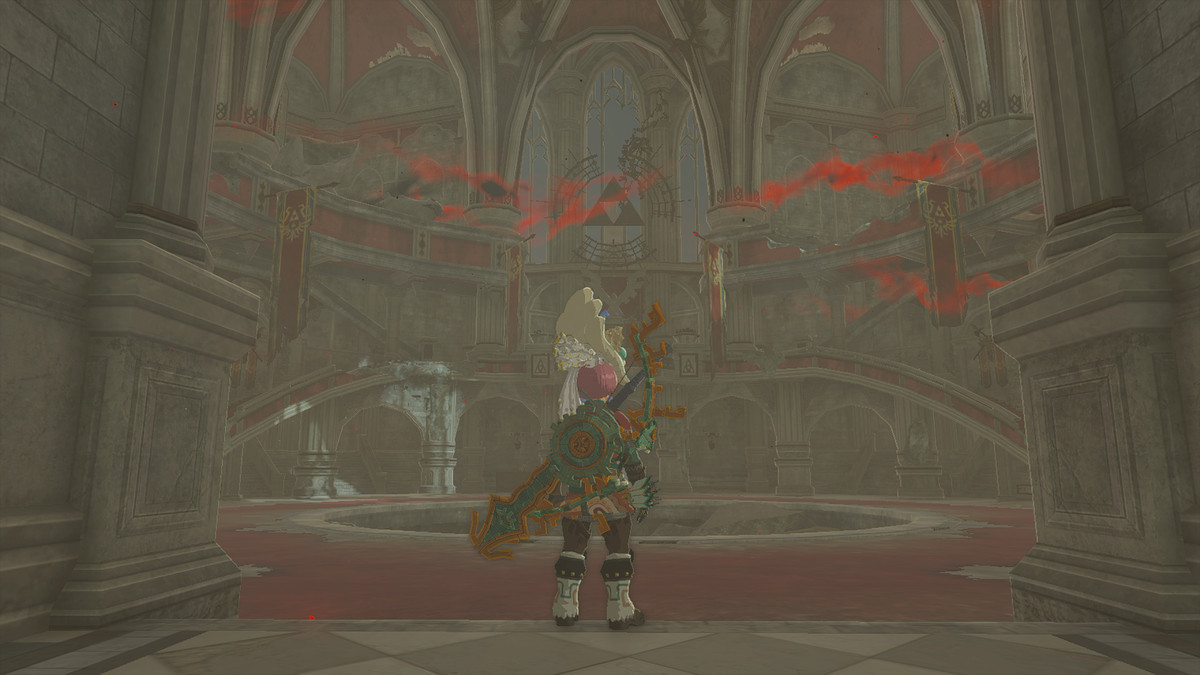 Link che esamina il castello di Hyrule in Zelda: Tears of the Kingdom