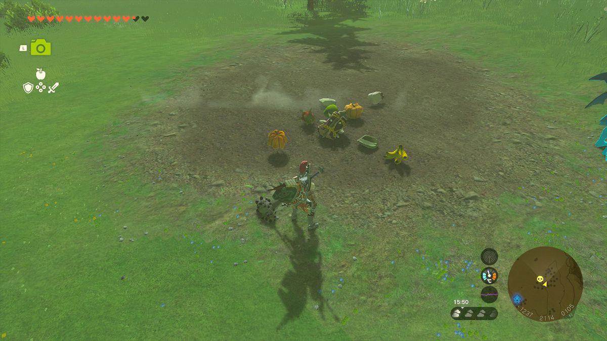 Link si trova accanto a una goccia di frutta di un Hinox sconfitto in Zelda Tears of the Kingdom.