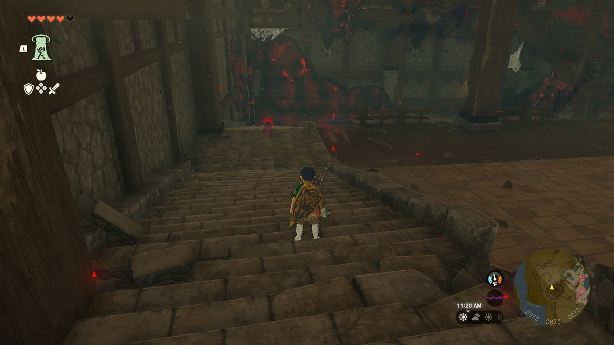 Link fissa una cupa pozzanghera nel castello di Hyrule in Zelda Tears of the Kingdom.