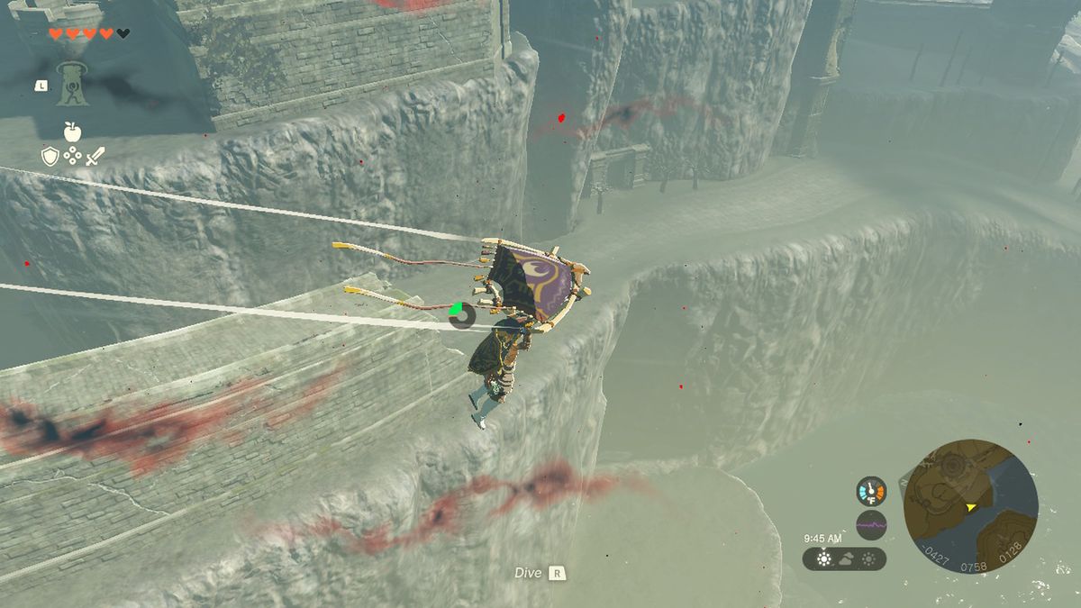 Link scivola su una scogliera vicino al Castello di Hyrule in Zelda Tears of the Kingdom.