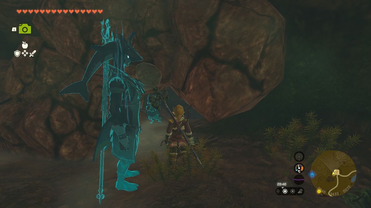 Link si trova accanto a un muro crepato in una caverna in fondo a un pozzo in Zelda Tears of the Kingdom.