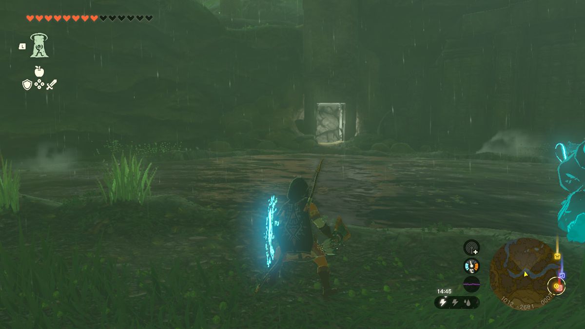 Link fissa un muro vicino al lago Dracozu in Zelda Tears of the Kingdom.