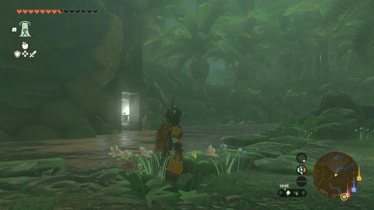 Link si trova accanto a un albero vicino al lago Dracozu in Zelda Tears of the Kingdom.