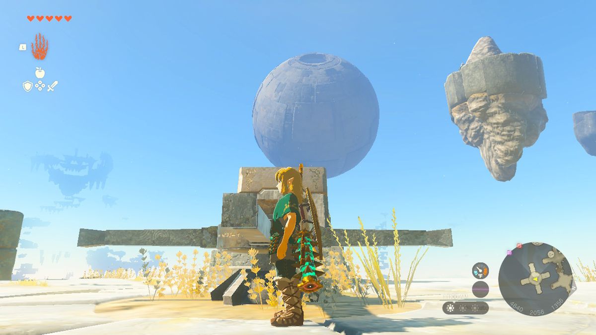 Link si trova su un'isola del cielo mentre una sfera incombe sullo sfondo in Zelda Tears of the Kingdom.
