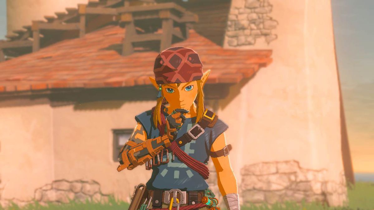 Link è perso nei suoi pensieri davanti alla telecamera mentre indossa l'armatura da arrampicata ambientata in Zelda: Tears of the Kingdom
