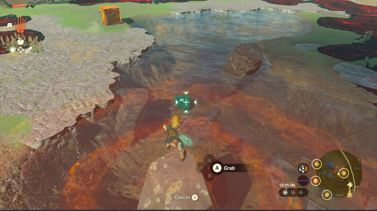 Link estrae l'occhio di una dea da un fiume in Zelda Tears of the Kingdom.