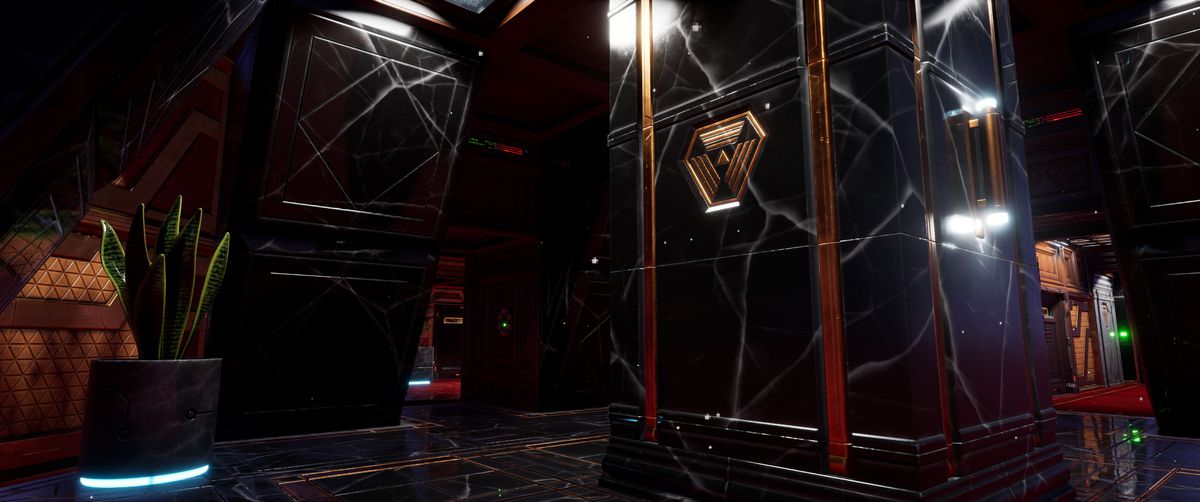 Una stanza in stile atrio sulla stazione spaziale, il remake di System Shock, piena di colonne di granito marmorizzato e orpelli art déco