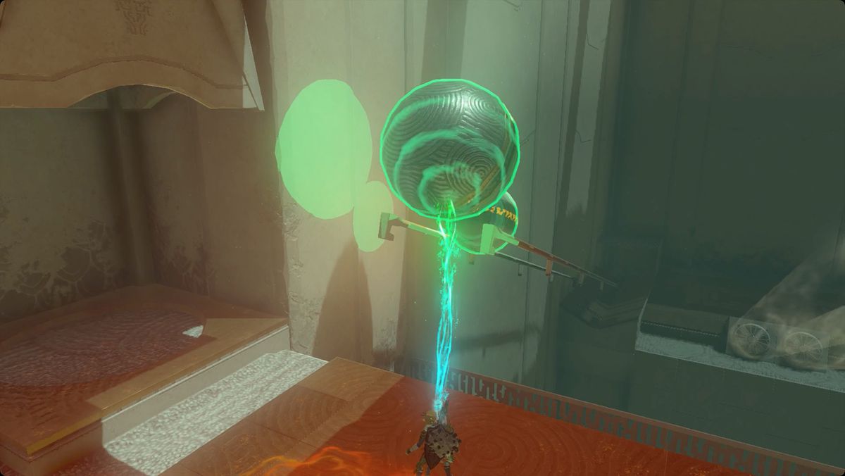 The Legend of Zelda: Tears of the Kingdom Link usa l'Ultramano per piazzare un paio di sfere di metallo sui binari nel Santuario di Mayamats