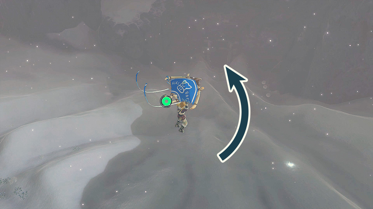 The Legend of Zelda: Tears of the Kingdom Link in parapendio nei Kopeeki Drifts con una freccia che punta all'ingresso della Kopeeki Drifts Cave.