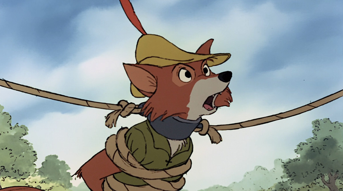 Il Robin Hood della Disney, una volpe antropomorfa vestita di verde, appare arrabbiato con delle corde avvolte intorno al corpo e un collare di metallo intorno al collo nel film d'animazione del 1973