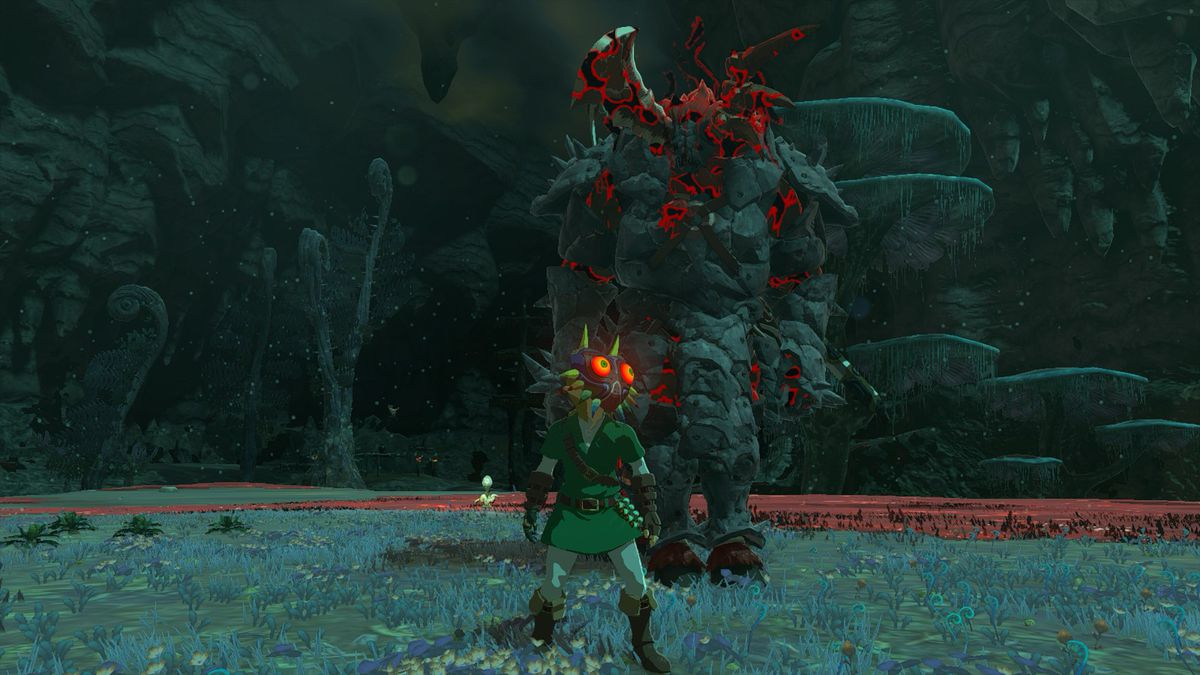Link che indossa la maschera di Majora in piedi di fronte a una Lynel d'argento corazzata fuori dal Colosseo galleggiante, che si trova nelle profondità in The Legend of Zelda: Tears of the Kingdom