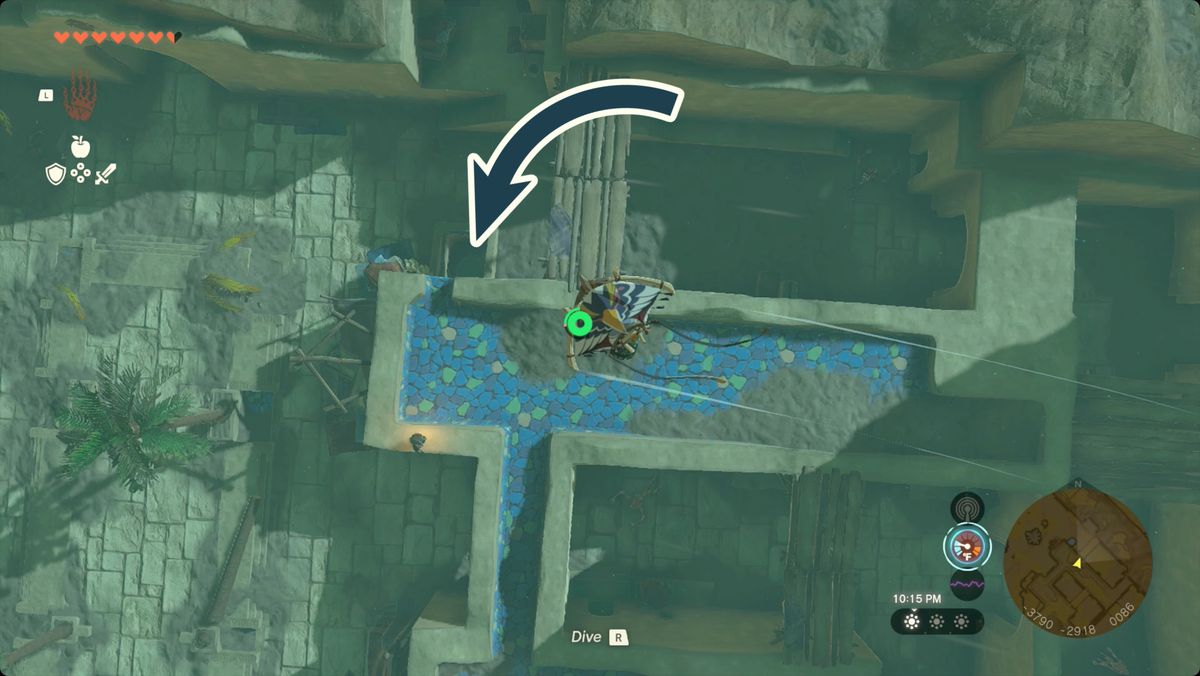 The Legend of Zelda: Tears of the Kingdom Link in parapendio sopra la città di Gerudo con l'ingresso alla grotta sottostante Fashion Passion contrassegnato.