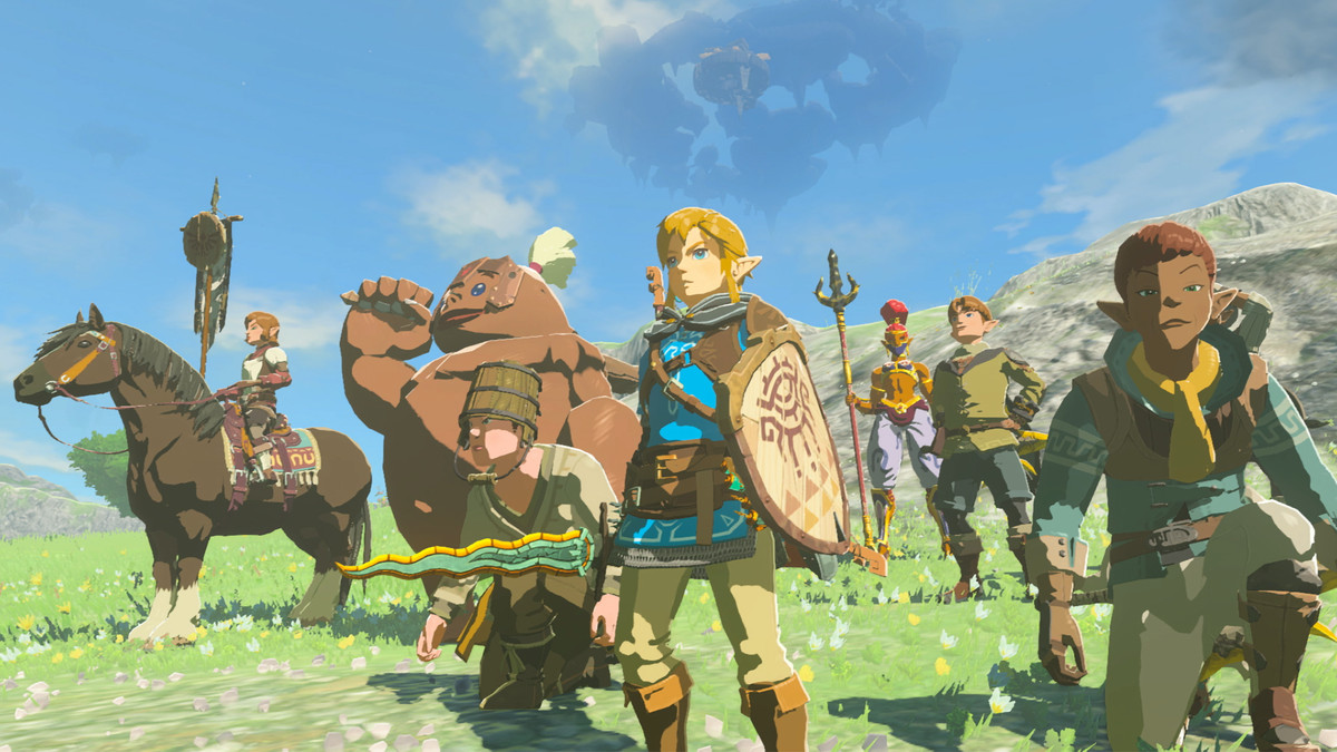 Link e diversi alleati sembrano eroici su un campo erboso in The Legend of Zelda: Tears of the Kingdom 