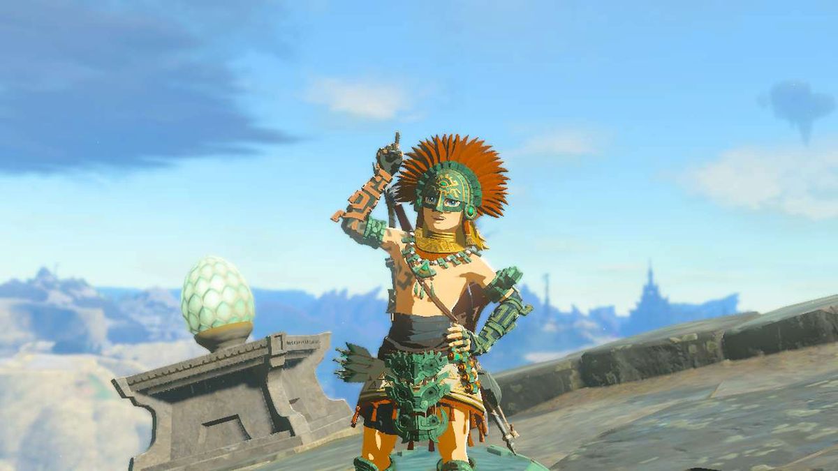 Link indossa con orgoglio l'armatura Zonaite mentre punta verso l'alto in Zelda: Tears of the Kingdom
