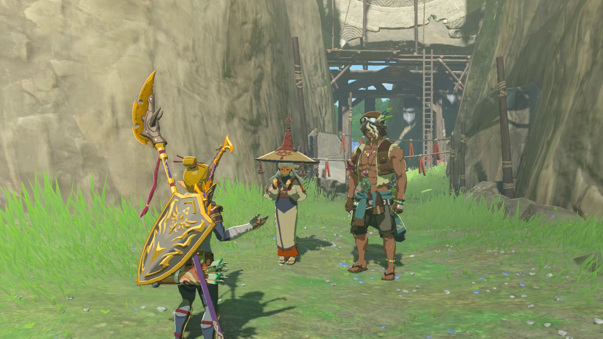 Link si alza e parla con Paya e Tauro, due persone in piedi vicino alle Rovine dell'Anello in Lacrime del Regno.  Paya è in piedi in abiti e un grande cappello, mentre Tauro ha gli addominali fuori.