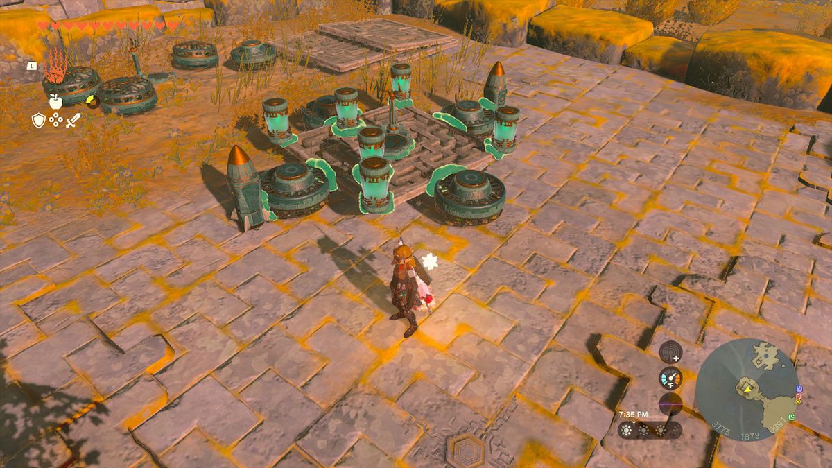 Link si trova accanto a un veicolo aereo costruito con dispositivi Zonai, dotato di quattro ventole, sei batterie e due razzi in Zelda: Tears of the Kingdom