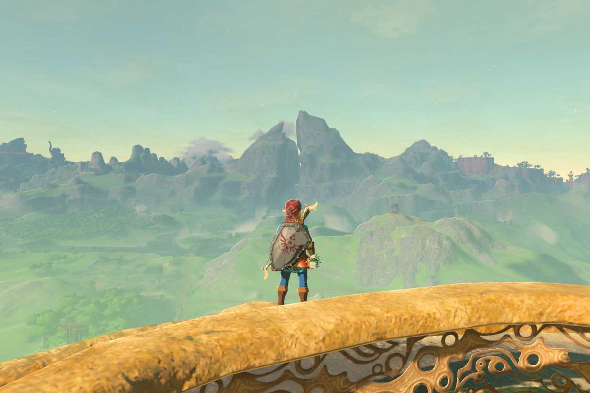 Link guarda Hyrule e Dueling Peaks in The Legend of Zelda: Breath of the Wild