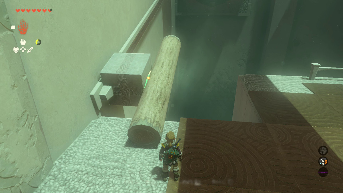 Link ha usato Ultrahand per incollare un tronco a una pietra sul muro che si trova su un cursore come parte di un puzzle nel Santuario di Oshozan-u