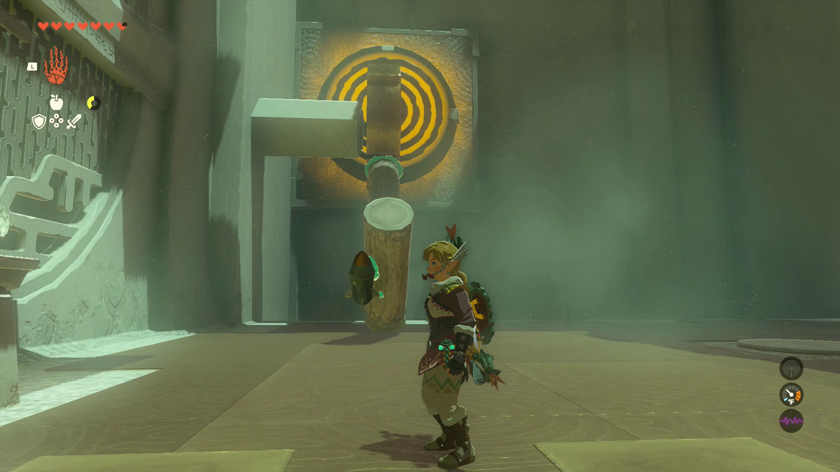 Link fa un passo indietro rispetto alla sua opera: due tronchi di legno con un razzo all'estremità, attaccati a un ingranaggio e pronti a colpire un bersaglio giallo nel Santuario di Oshozan-u