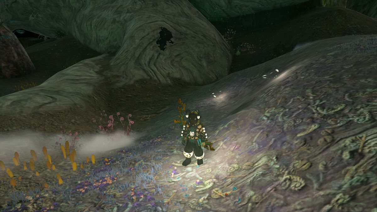 Link in the Tears of the Kingdoms Depths nell'armatura del minatore con diverse piccole pozzanghere di luce intorno a lui.