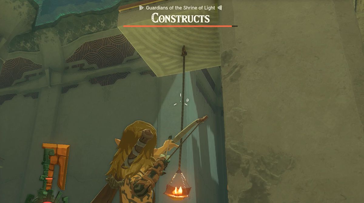 Link fa fuoco con un arco contro una torcia sospesa nella missione 