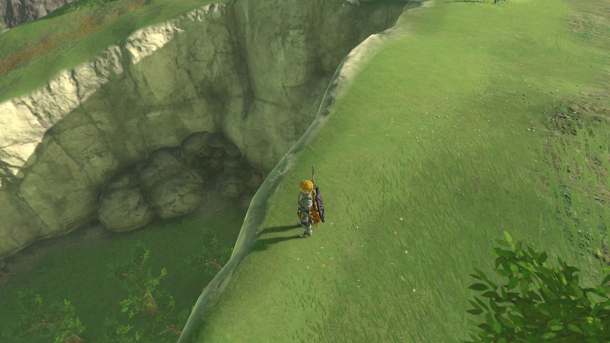 Link in piedi vicino alle rocce accanto al laboratorio di ricerca del villaggio di Hateno in Zelda: Tears of the Kingdom 